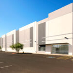 Rolled Alloys announces new Phoenix Arizona facility with coming soon message and desert landscape background