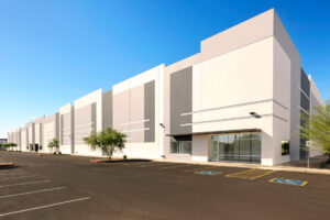 Rolled Alloys announces new Phoenix Arizona facility with coming soon message and desert landscape background